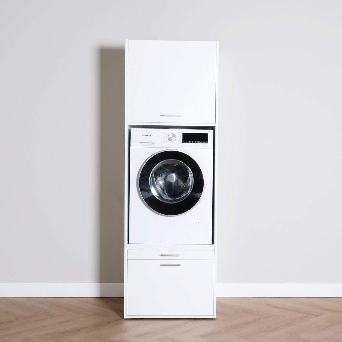 White freestanding laundry cabinet with front-loading washing machine, upper and lower storage compartments.